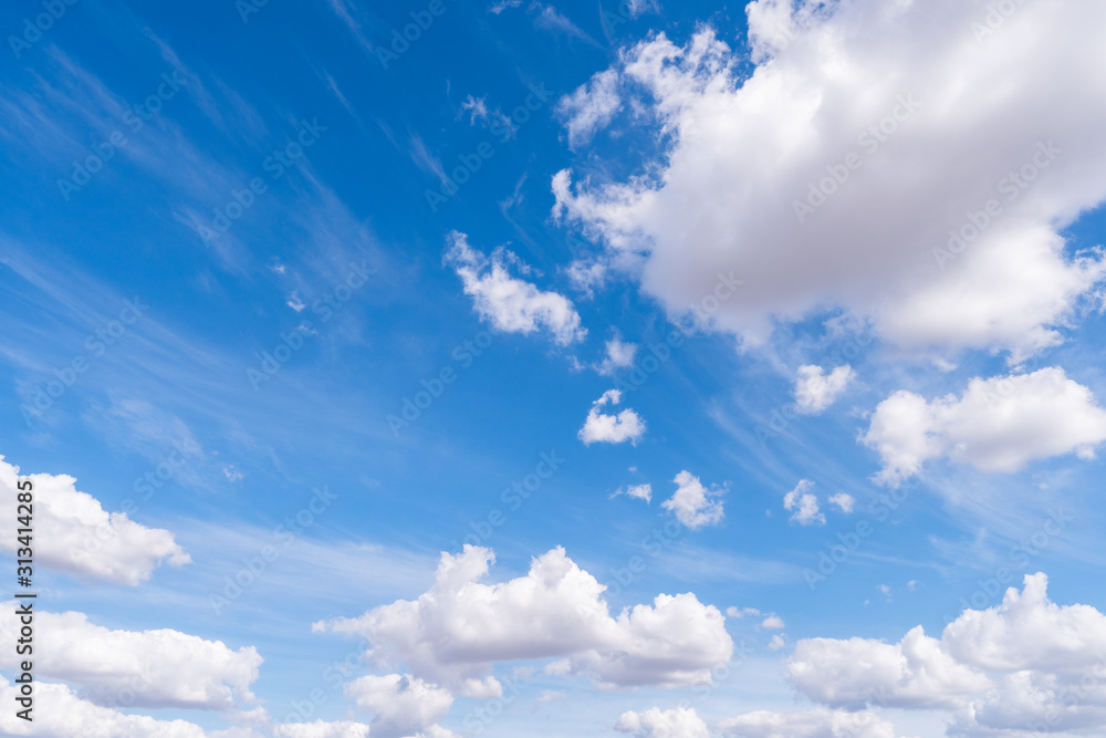 The blue sky with moving white clouds. The most of clouds are beautiful color and shade, suitable for use as background image. The blue sky with moving white clouds. The most of clouds are beautiful color and shade, suitable for use as background image.