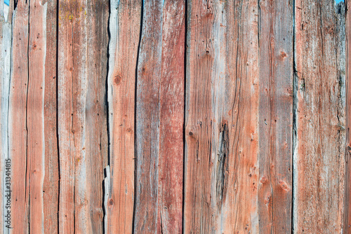 Old shabby wooden planks with cracked color paint