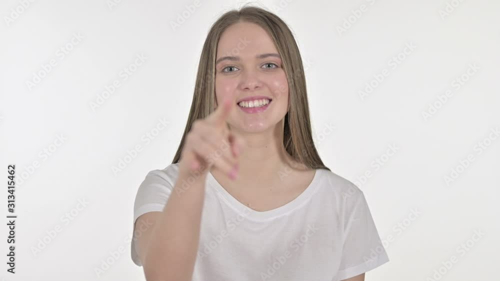 Inviting Beautiful Young Woman Pointing Finger, White Background Inviting Beautiful Young Woman Pointing Finger, White Background