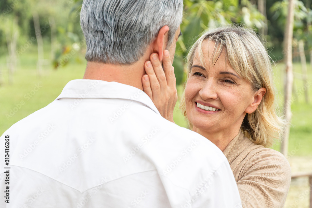 close up candid portrait senior attractive couple talking together at park, Mature wife looking to eyes of husband and smile with love, Old woman touch man face, Happy retirement lifestyle concept close up candid portrait senior attractive couple talking together at park, Mature wife looking to eyes of husband and smile with love, Old woman touch man face, Happy retirement lifestyle concept