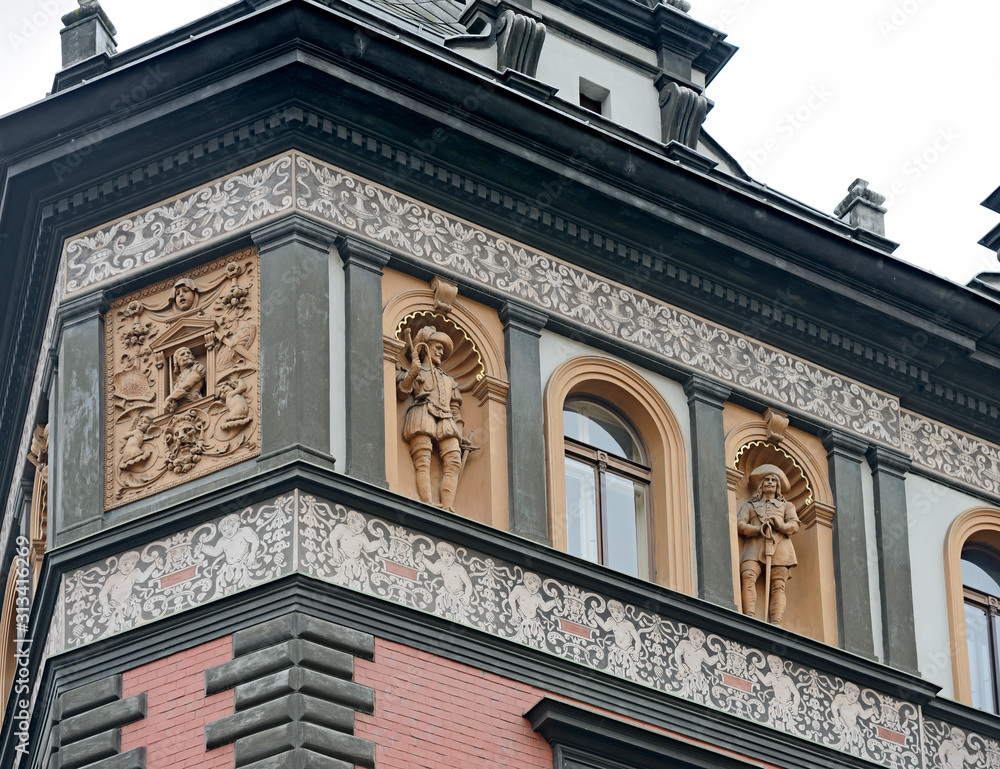 Facade detail of old building on Porici street in Prague.