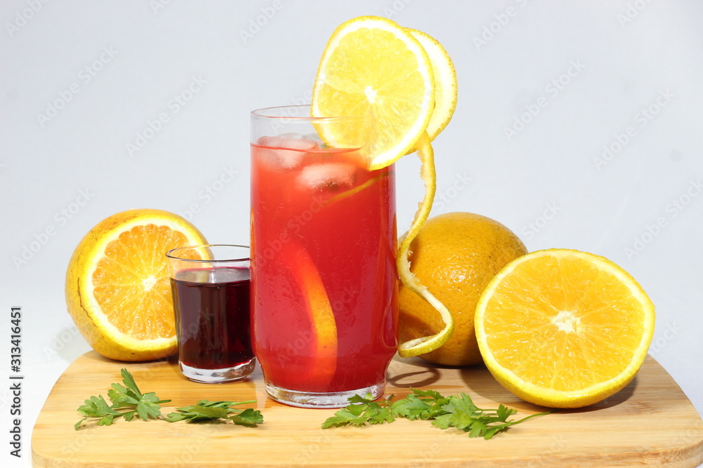 Strawberry juice with orange organic well cold light background Strawberry juice with orange organic well cold light background