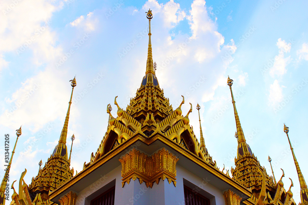 The golden pagoda stands majestically in Thai temple