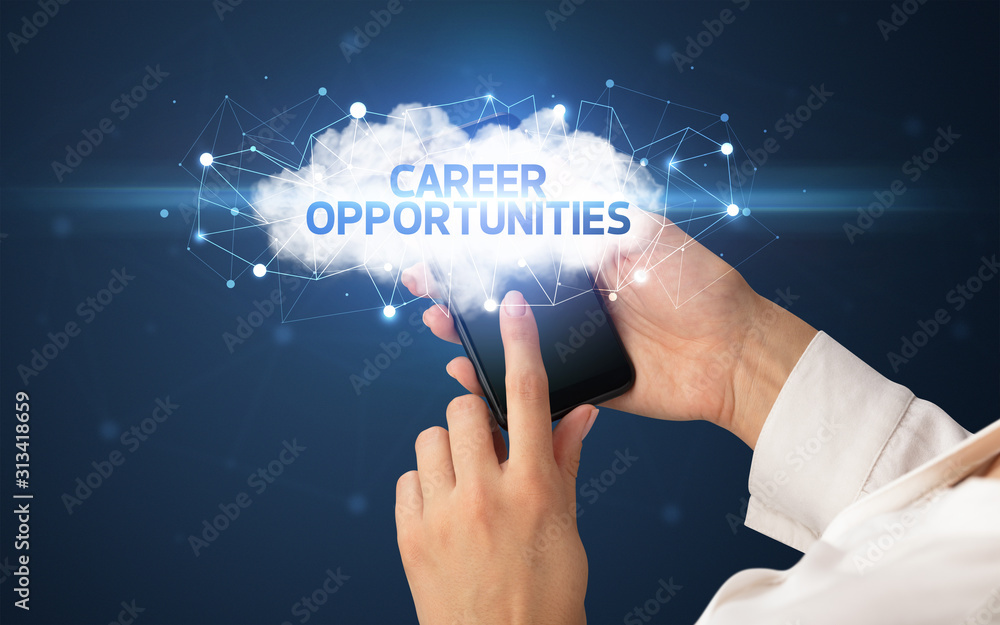Female hand touching smartphone with CAREER OPPORTUNITIES inscription, cloud business concept Female hand touching smartphone with CAREER OPPORTUNITIES inscription, cloud business concept