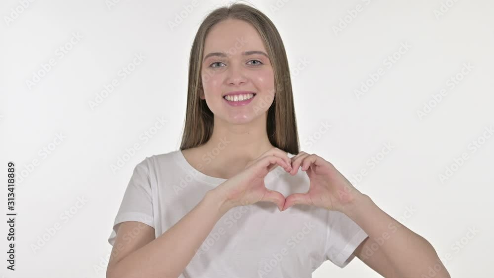 Portrait of Beautiful Young Woman making Heart Shape with Hand Portrait of Beautiful Young Woman making Heart Shape with Hand