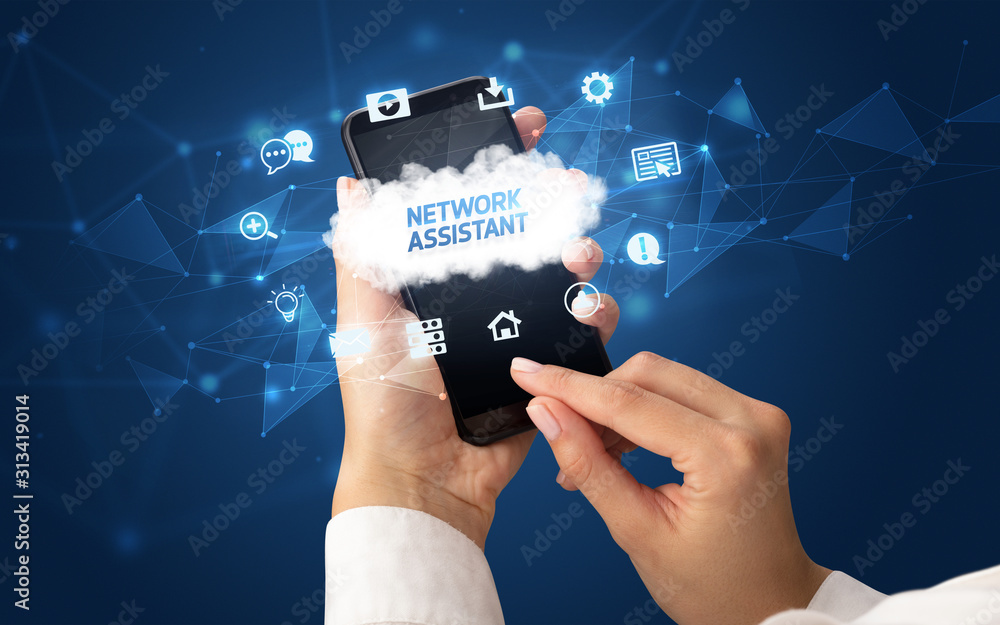 Female hand holding smartphone with NETWORK ASSISTANT inscription, cloud technology concept Female hand holding smartphone with NETWORK ASSISTANT inscription, cloud technology concept