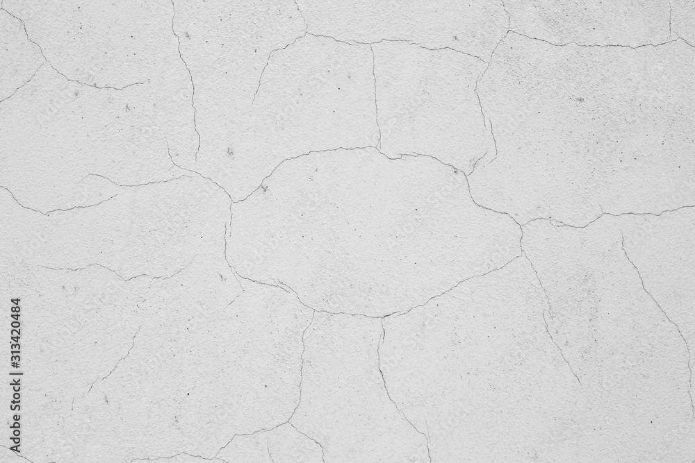 Fototapeta premium Old peeling paint on the wall. Gray abstract background..Beautiful gray textured stucco on the wall..Background from gray stucco.