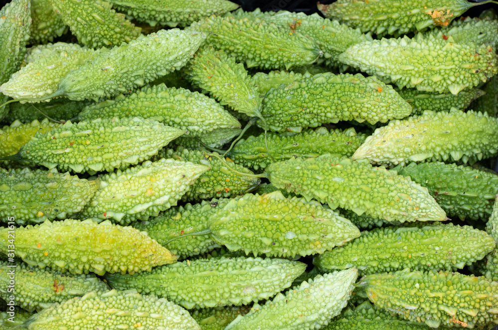 Close-up of balsam pear fruit in a crate. Close-up of balsam pear fruit in a crate.