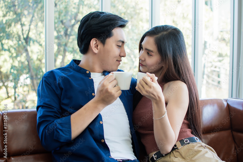 Couple is holding cups of coffee