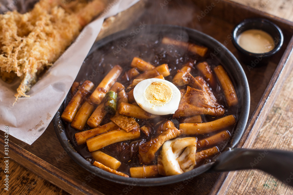 Korean rice cakes in black soybean sauce. Jjajang tteokbokki. Korean rice cakes in black soybean sauce. Jjajang tteokbokki.
