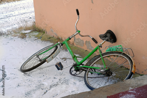 Old bicycle abandoned on a street