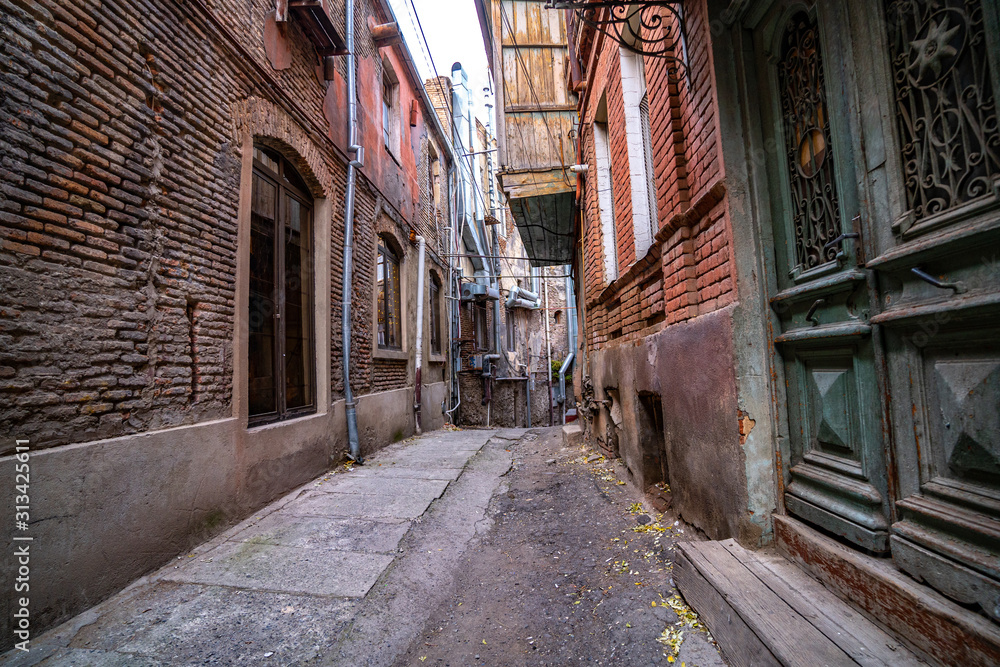 Alley between old houses on an old street in Tbilisi
