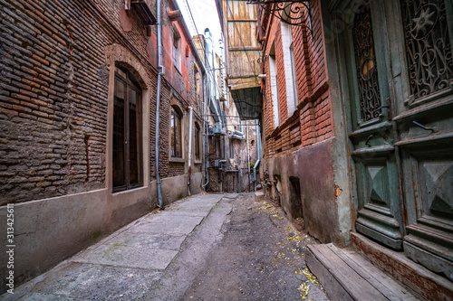 Alley between old houses on an old street in Tbilisi