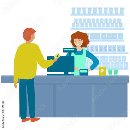 Man is paying the cash desk of supermarket. Man pays for purchases