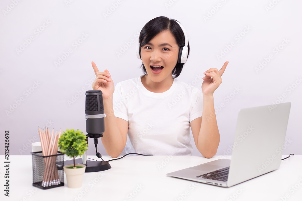 Woman blogger speaking in front of camera and recording video for social media Woman blogger speaking in front of camera and recording video for social media