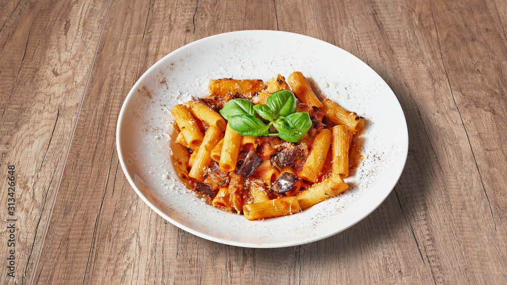 Plate of Delicious italian food on Textured wooden background Plate of Delicious italian food on Textured wooden background