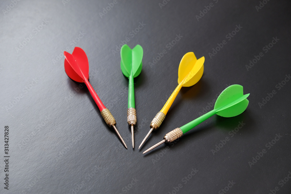 red, yellow, green dart arrows on black background, red, yellow, green dart arrows on black background,