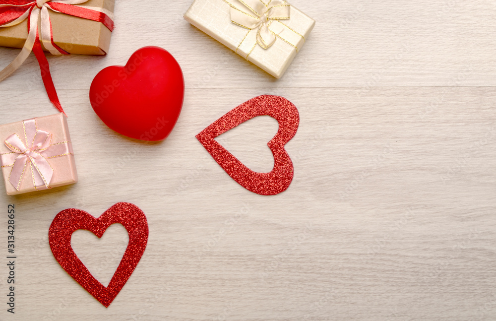 Gift boxes, decorative hearts on a light background. Gift boxes, decorative hearts on a light background.