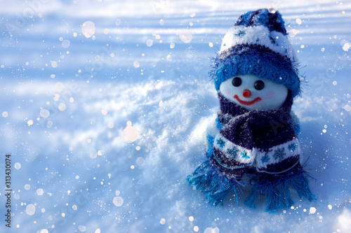 winter background with snowman and snow