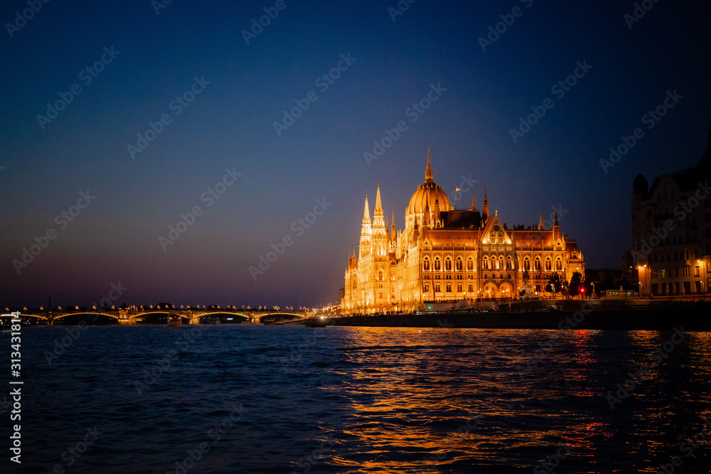 Obraz premium Budapest Hungary Parliament Building at Night from Danube River