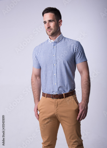 young man in blu shirt and jeans