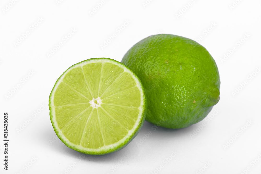 Fresh lime, half and quarter part on white background. Green citrus fruit. Fresh lime, half and quarter part on white background. Green citrus fruit.