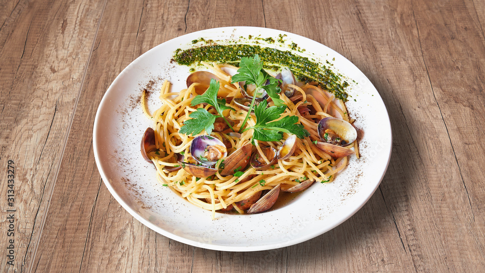 Plate of Delicious italian food on Textured wooden background Plate of Delicious italian food on Textured wooden background