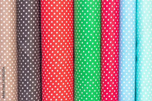 abstract background, cotton fabric texture. Polka dot fabric in different colors. drapery