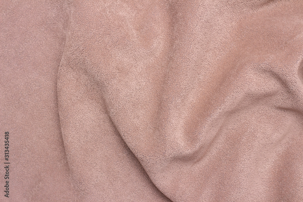 background texture of faux suede closeup. faux brown suede by the waves. close up background texture of faux suede closeup. faux brown suede by the waves. close up