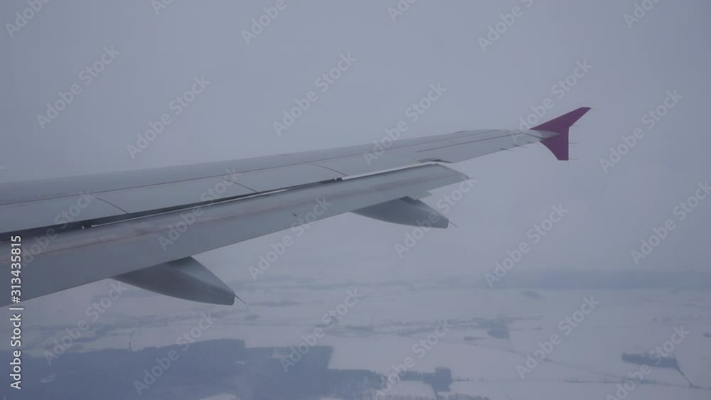 Flight of the plane. Plane wing. Poor visibility strong wind Flight of the plane. Plane wing. Poor visibility strong wind