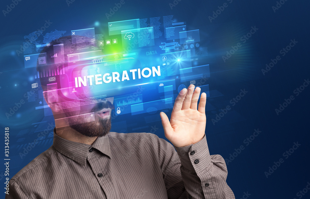 Businessman looking through Virtual Reality glasses with INTEGRATION inscription, innovative security concept Businessman looking through Virtual Reality glasses with INTEGRATION inscription, innovative security concept