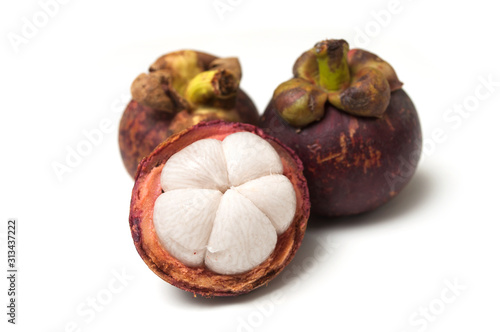 Closeup of purple mangosteen on white background