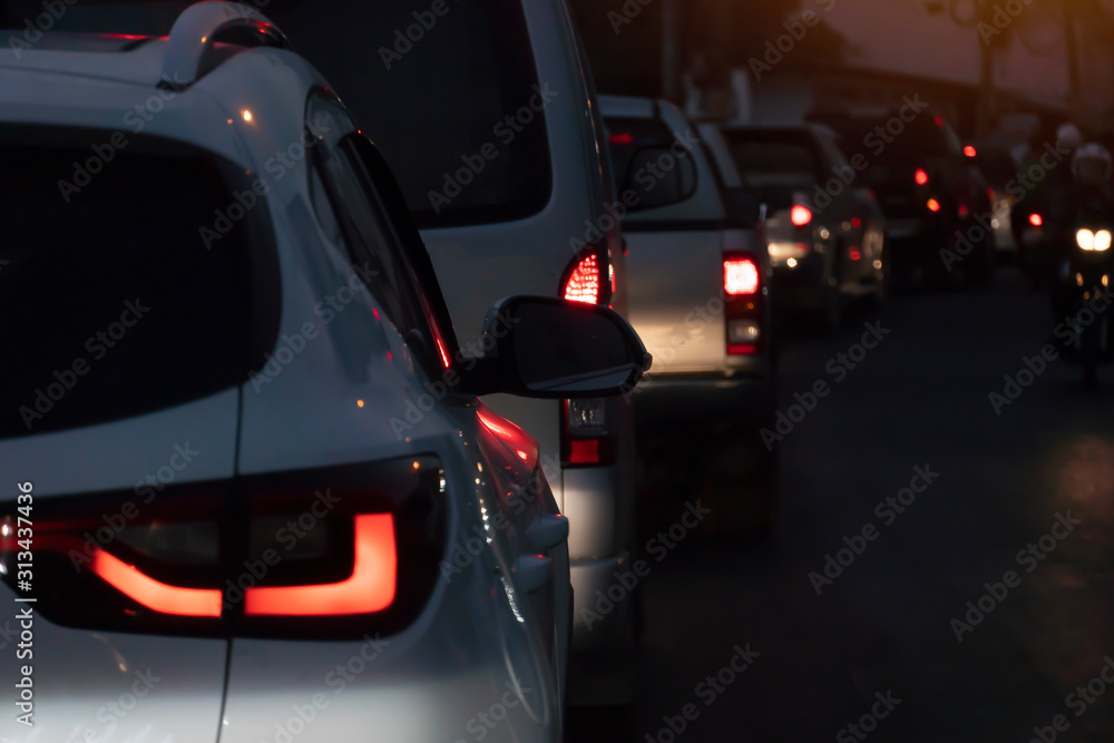 Blurred image of cars on the road with light break at in evening.