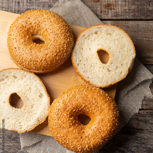 Sesame bagels on wooden background