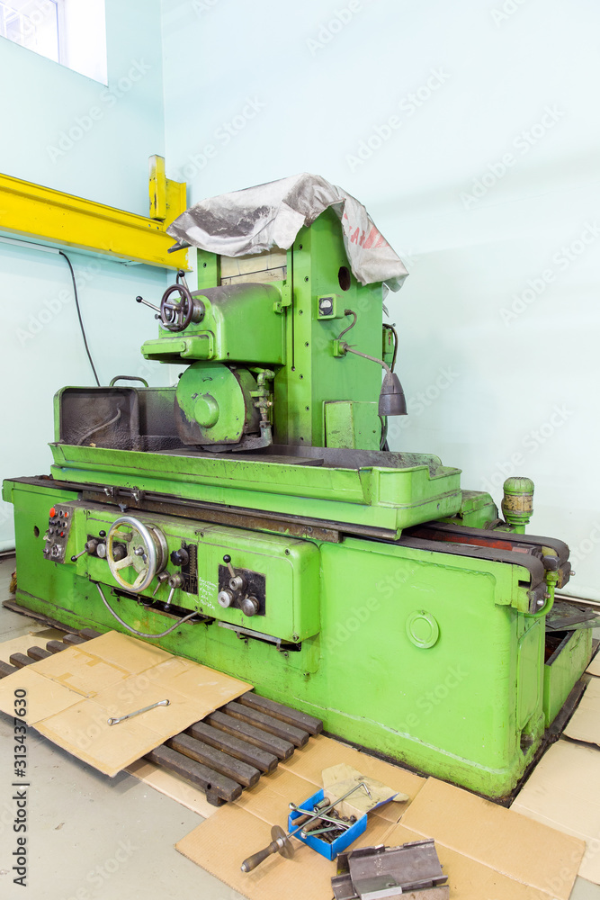Old screw cutting lathe at engineering plant Old screw cutting lathe at engineering plant