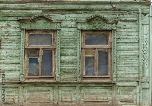 antique wooden windows carved platbands in the village, Russian outback © Irina