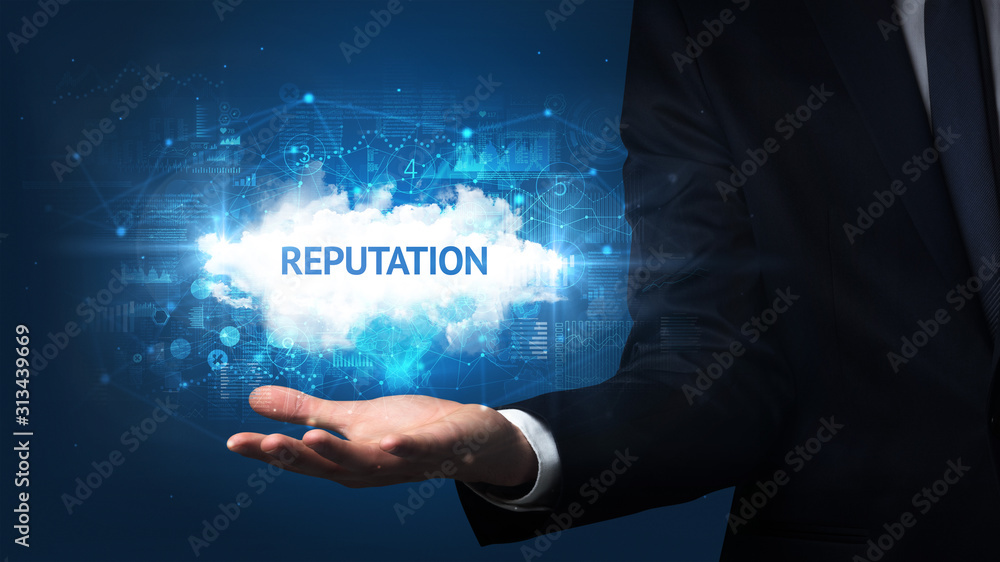Hand of Businessman holding REPUTATION inscription, successful business concept Hand of Businessman holding REPUTATION inscription, successful business concept