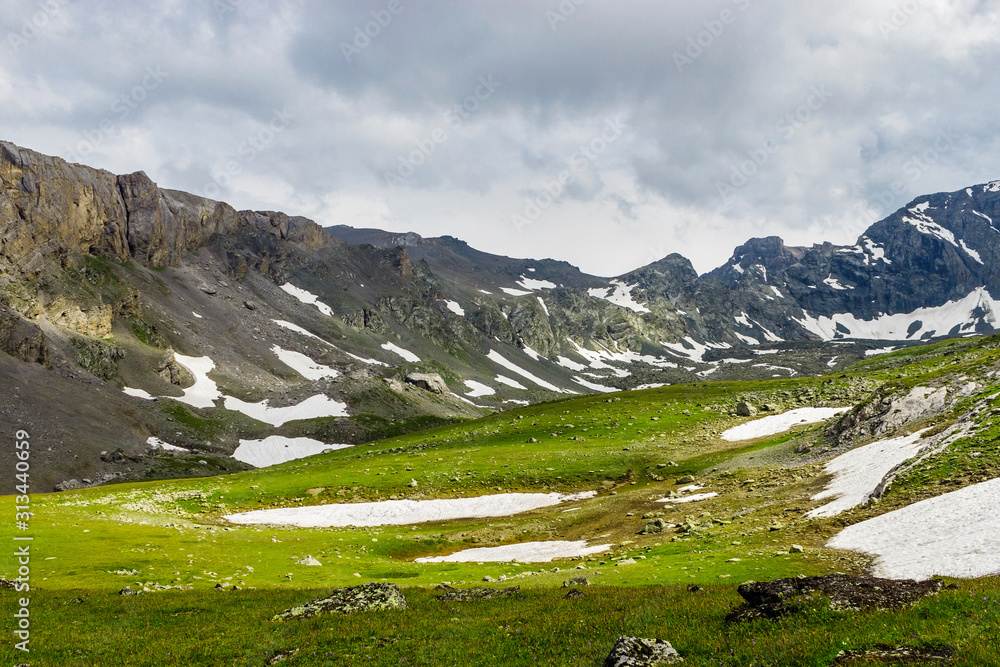 valley in the caucasus mountains on a cloudy summer day