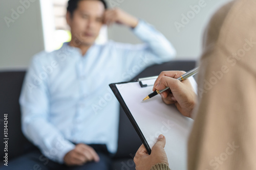 psychologist talking with depressed patient about mental condition.