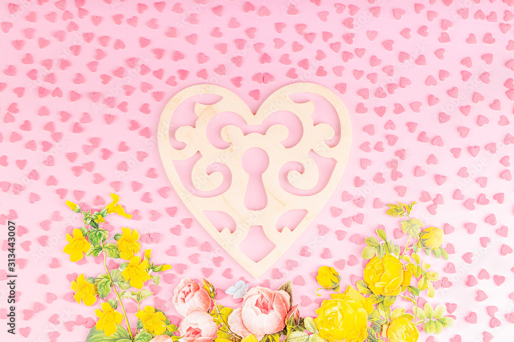 Wooden Heart Shaped Decoration with Paper 3D Flowers and Small Hearts on a Pink Background. Concept of Valentines Day Celebration 