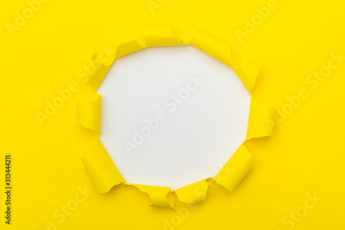 Yellow Ripped Open Paper On White Paper Background Stock Photo, Picture and  Royalty Free Image. Image 76327572.