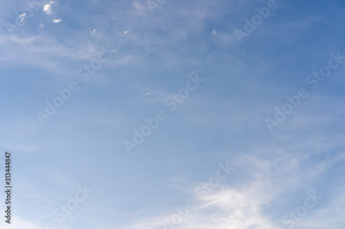 Tiny clouds against blue sky.