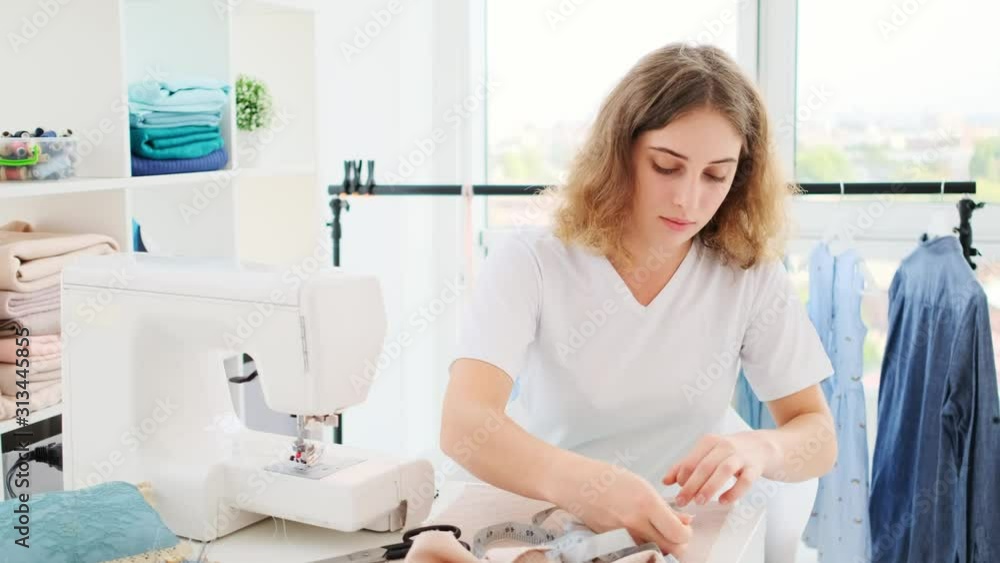 Nice girl is working for new design to sew Nice girl is working for new design to sew