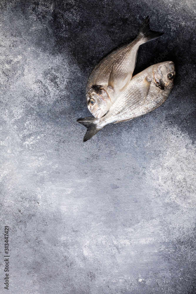 Fresh uncooked Dorado or sea bream fish Fresh uncooked Dorado or sea bream fish