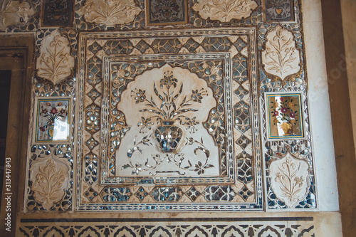 Agra, India - marble and mirrors on wall in Hall of thousands mirrors, Amber Fort near Jaipur, Rajasthan, India. Unesco World Heritage Site