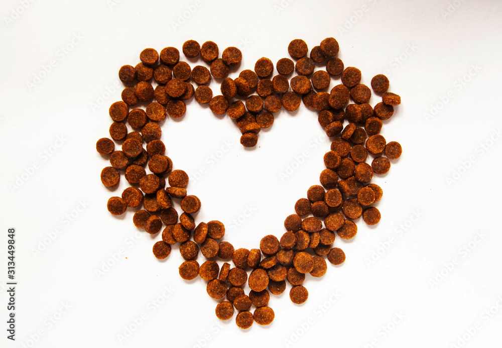 Heart shaped pet food. Food for cats and dogs. Heart with place for text Heart shaped pet food. Food for cats and dogs. Heart with place for text