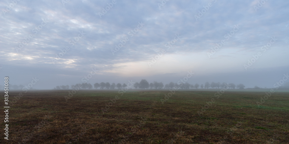 Scenic View Of Landscape Against Sky during Foggy Weather