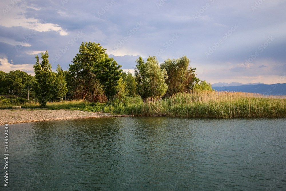 Beautiful view of the coastline of the Lake Ohrid on sunset, Republic of North Macedonia Beautiful view of the coastline of the Lake Ohrid on sunset, Republic of North Macedonia