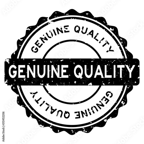 Grunge black genuine quality word round rubber seal stamp on white background
