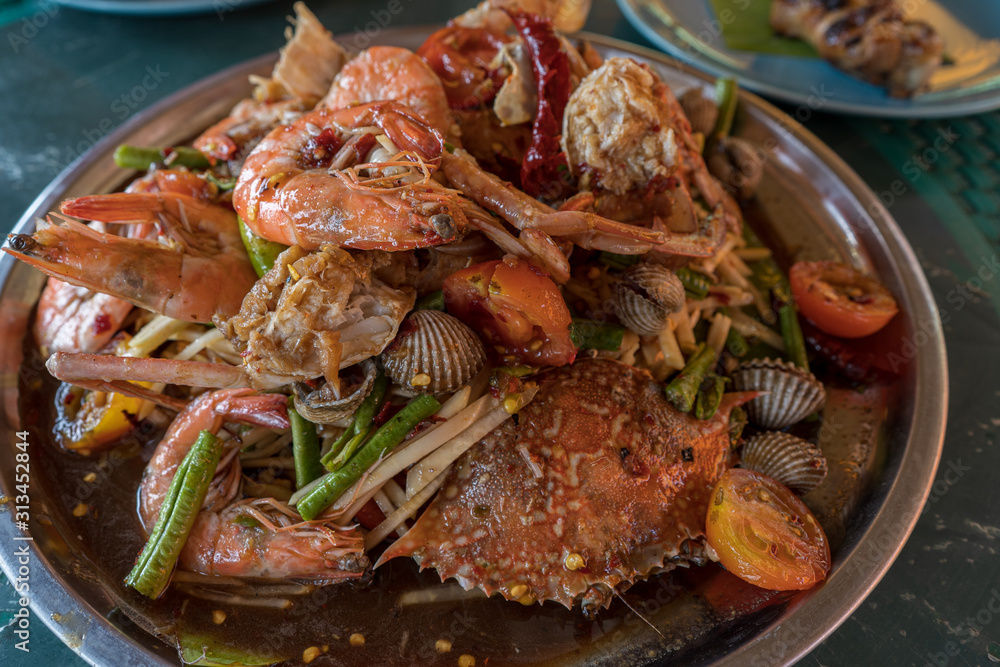 spicy shrimps salad in metal plate. spicy shrimps salad in metal plate.